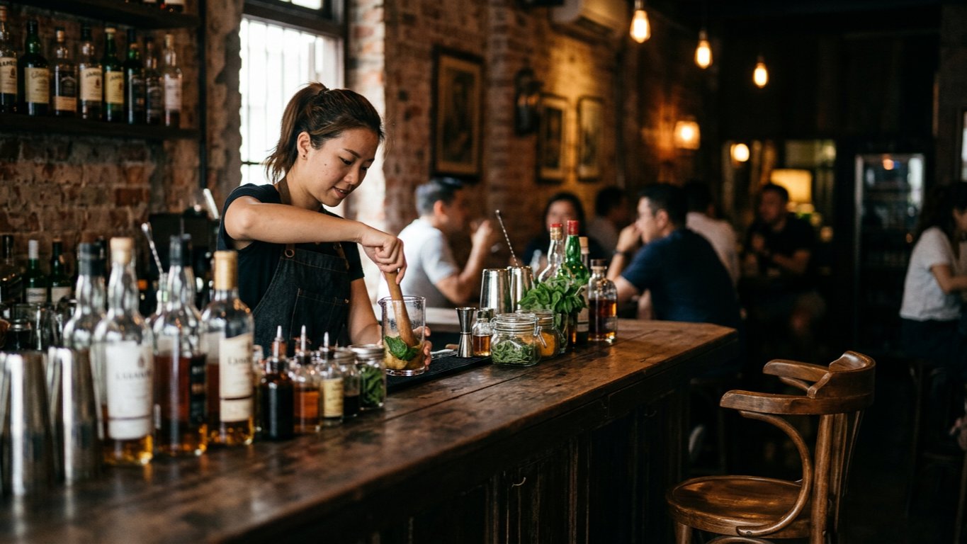 malaysian-chinese-bartender-muddling-craft-cocktail-ingredie