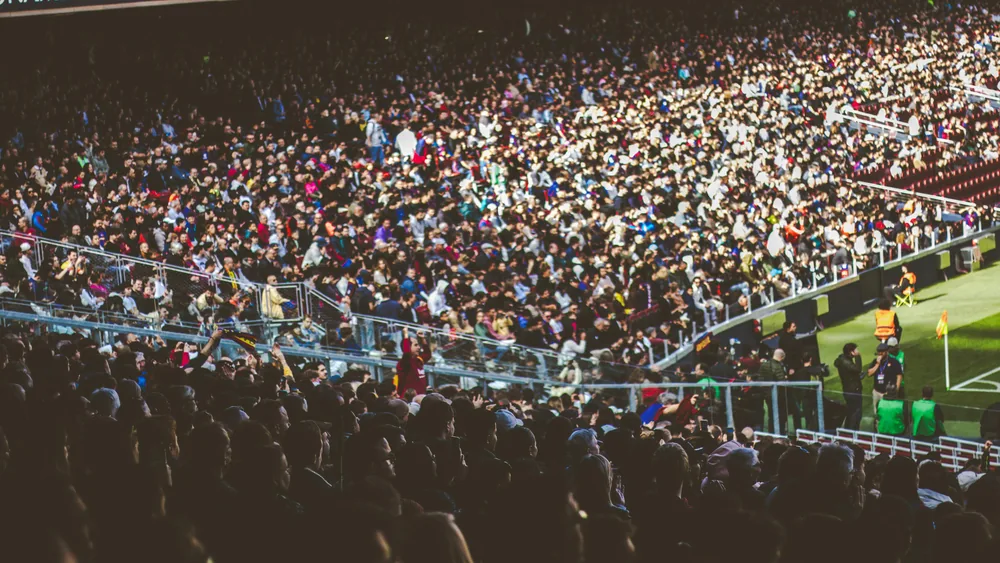 Football stadium with anxious supporters