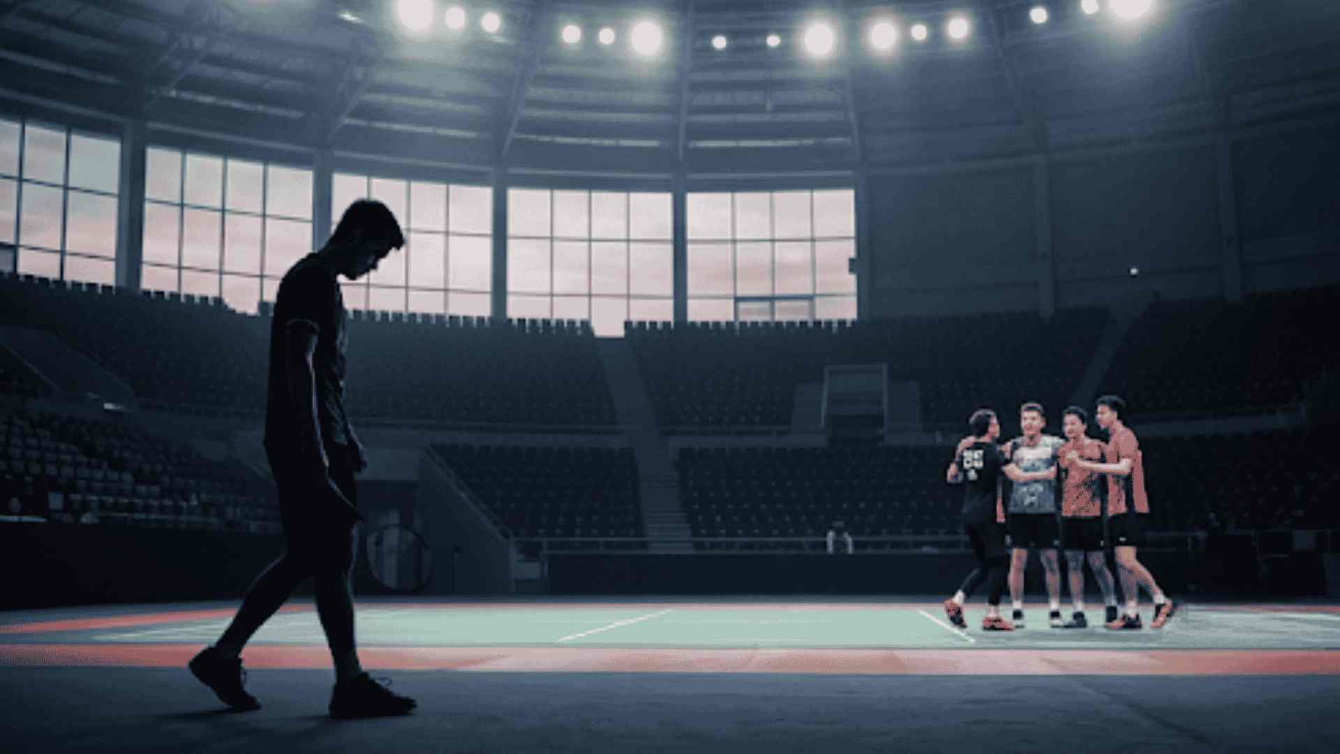 a_solitary_figure_walks_away_from_a_victorious_malaysian_badminton - Copy - Copy